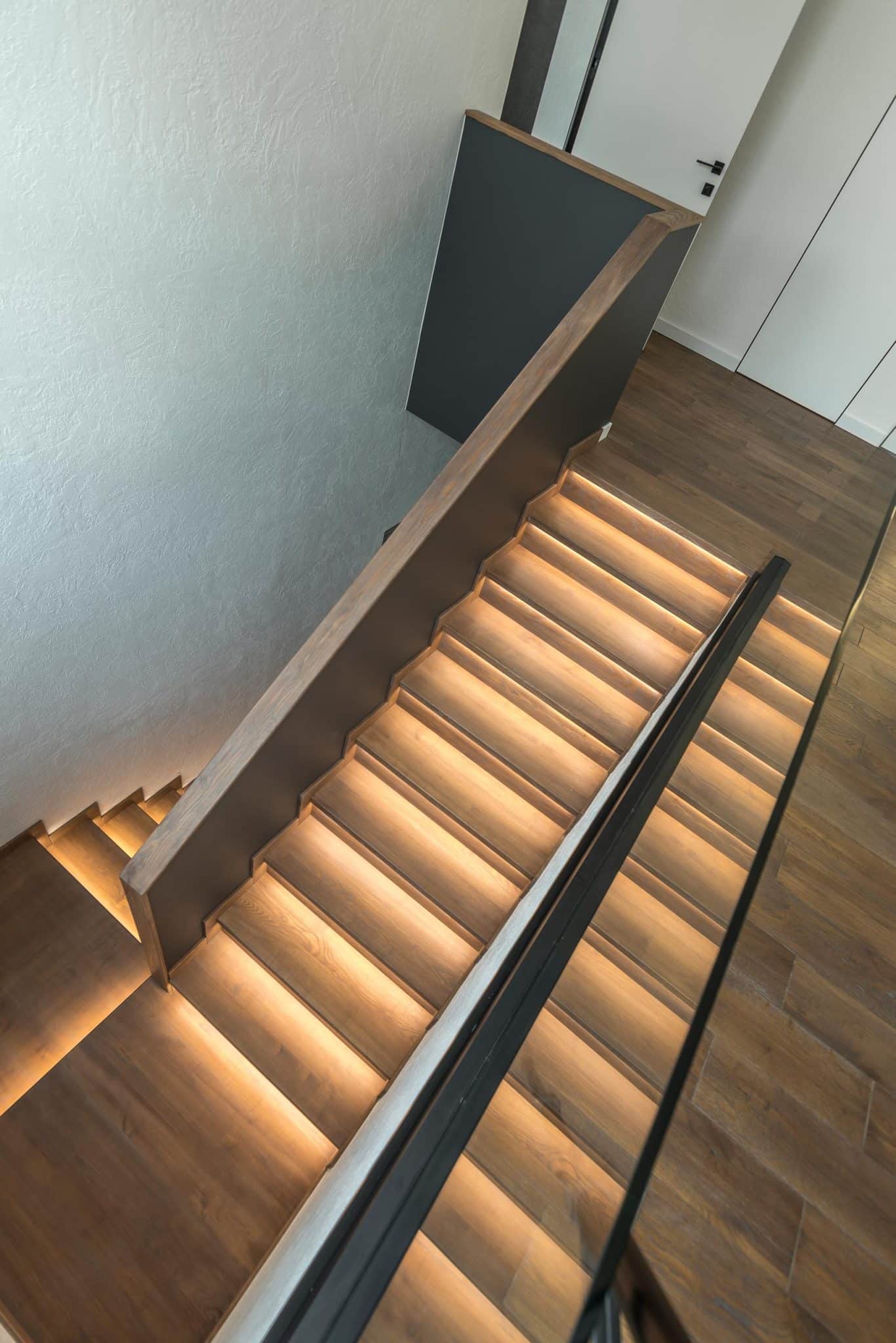 Led Strip Under The Stairs Of This Home Adds A Warm Glow To The Interior